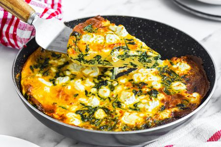 Spinach Frittata Raised from Pan with More Frittata