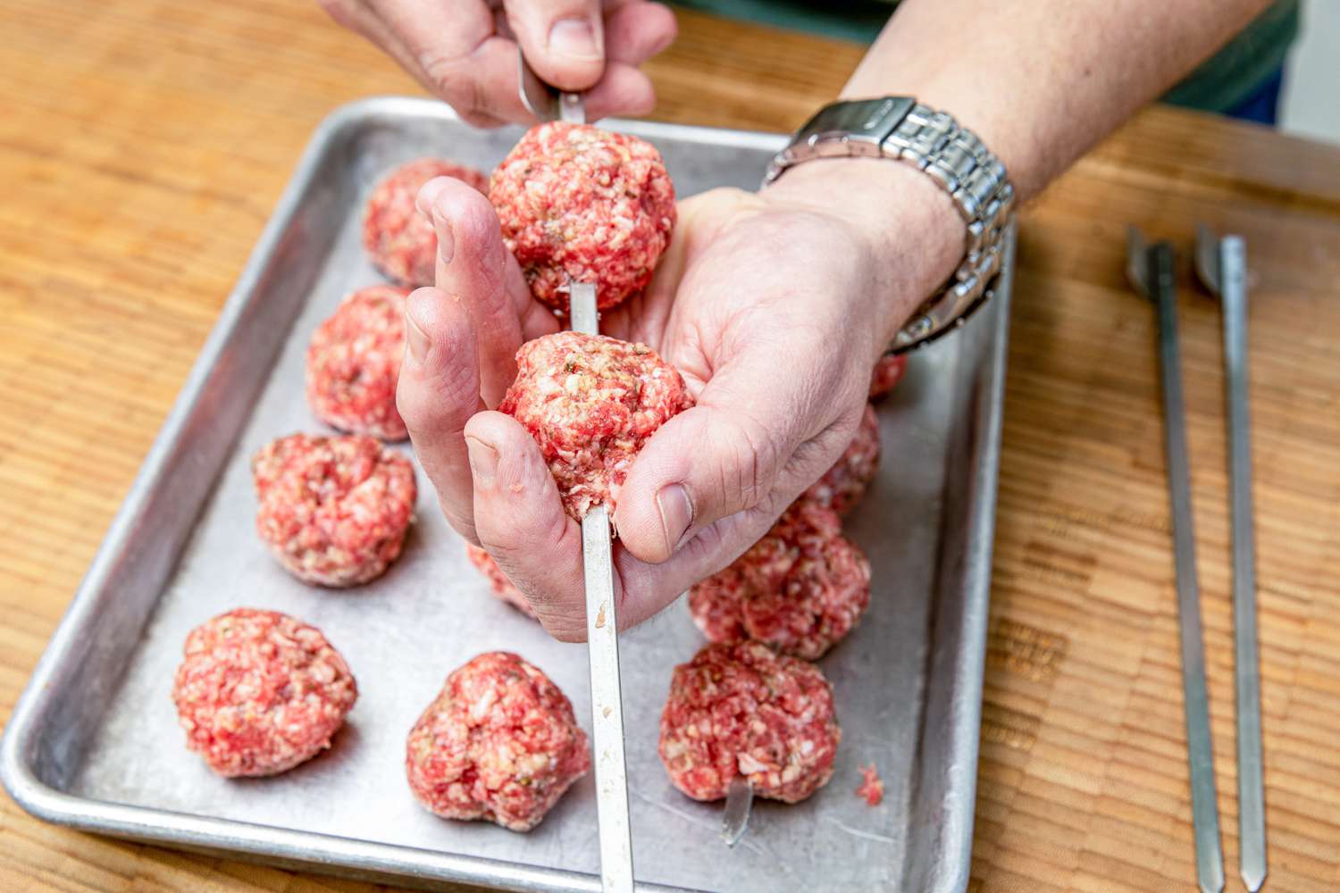 Meatballs Skewered With Flat Metal Skewers for Grilled Greek Meatball Recipe