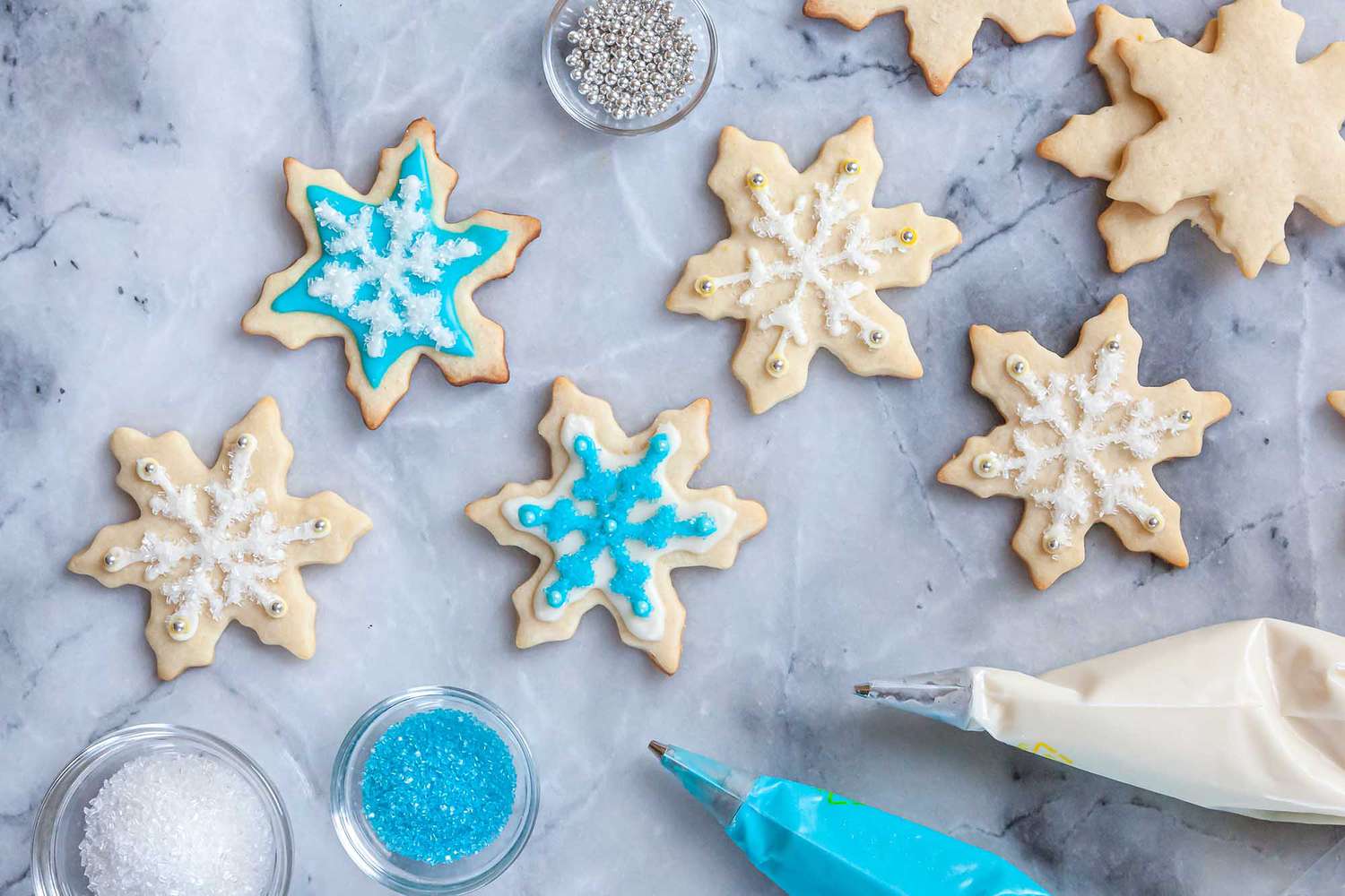 Snowflake sugar cookies decorated with Royal icing for sugar cookies.