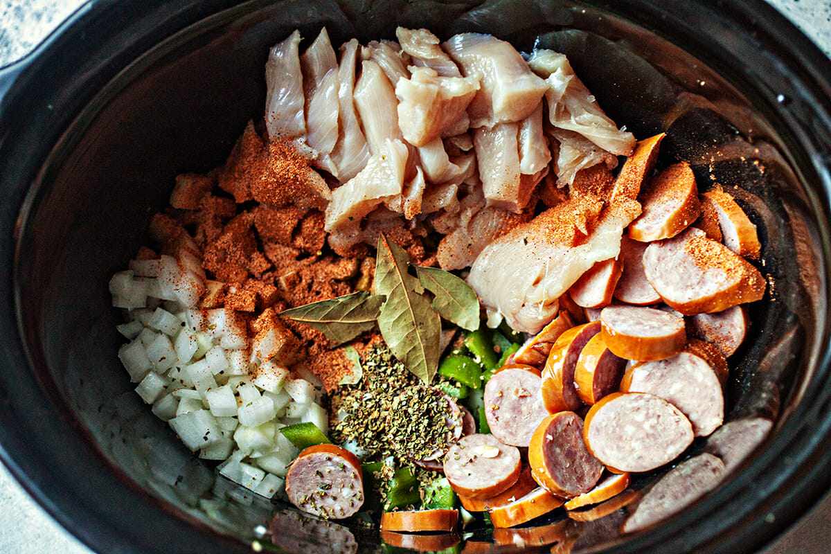 How to Make Jambalaya slow cook the chicken, shrimp and sausage