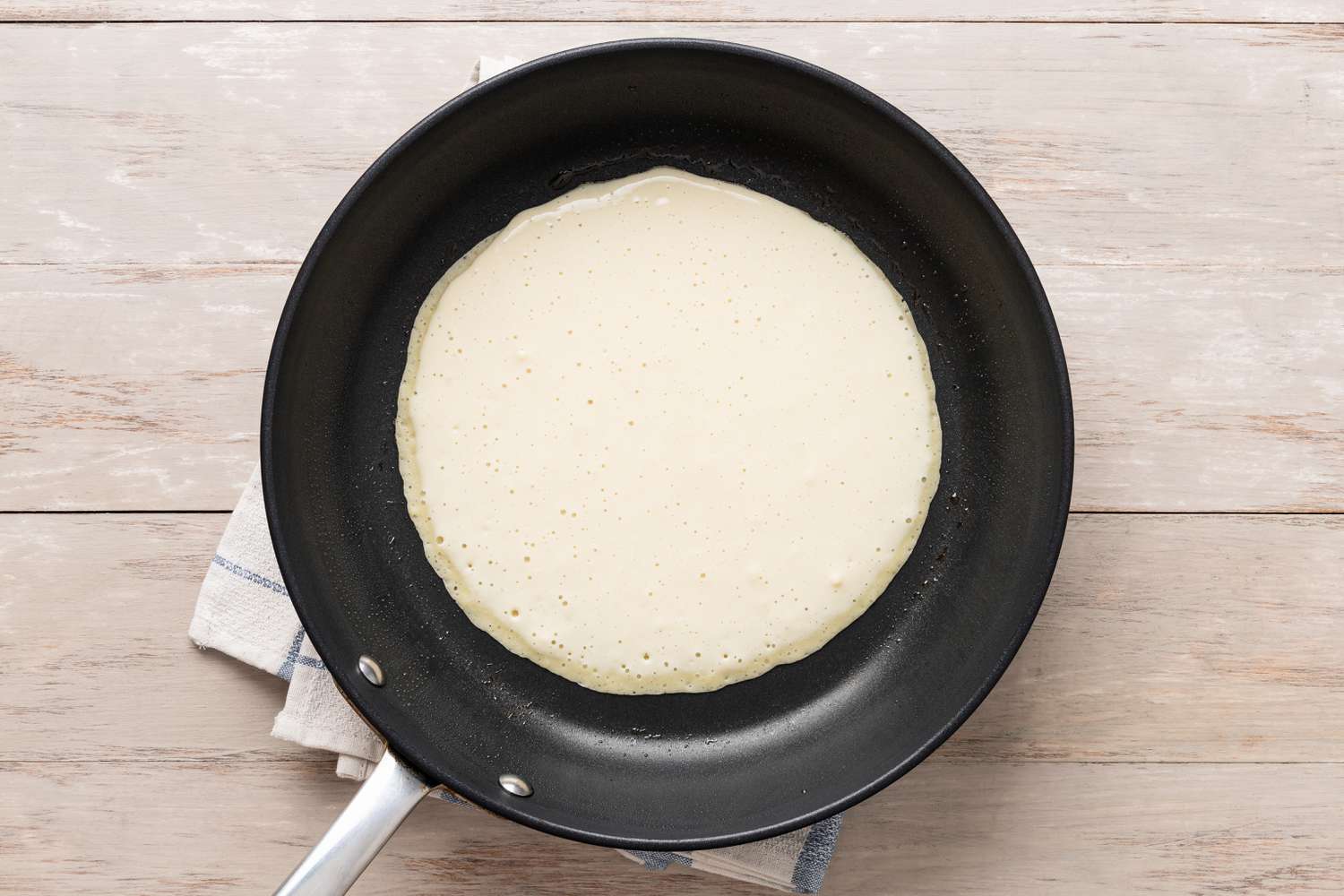 Pannenkoeken (Dutch Pancakes) batter cooking on the skillet