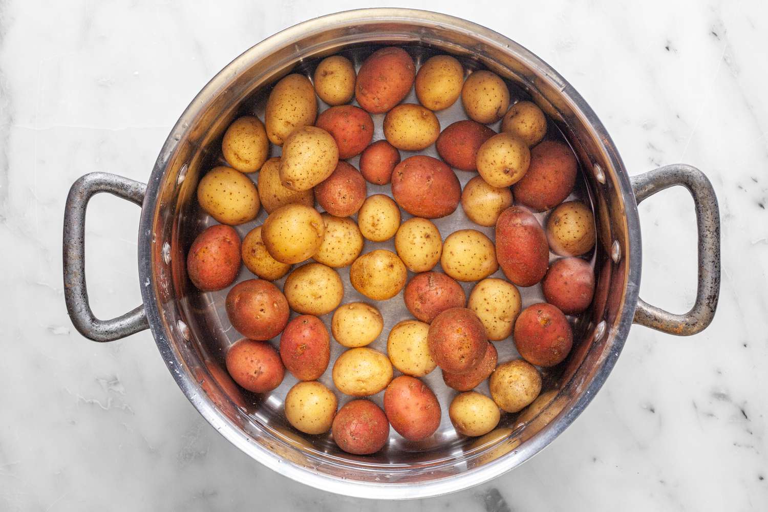 Yellow and Red Potatoes in a Pot of Water for Smashed Potatoes Recipe