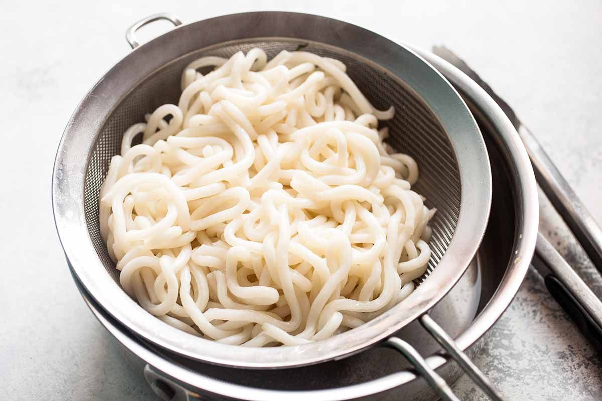 Chinese chicken lo mein drain the cooked noodles