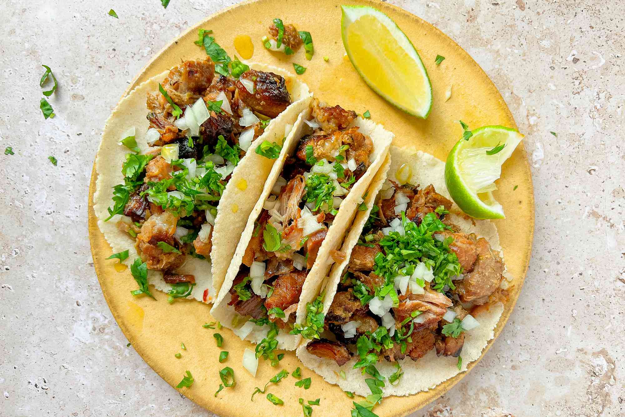 Carnitas Tacos with Chopped Cilantro and Lime Wedges