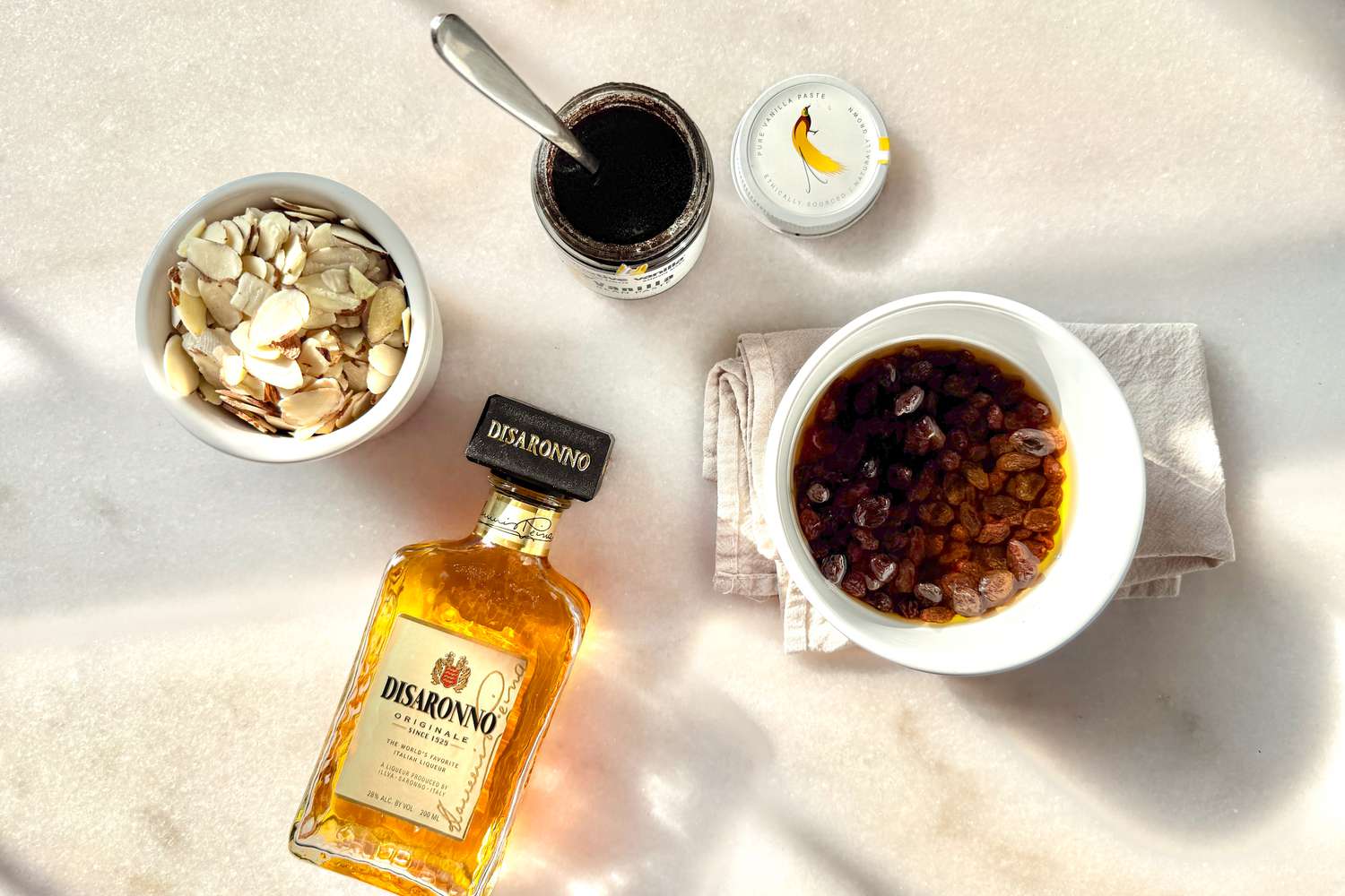 Overhead view of ingredients for Princess Diana's favorite bread pudding on a marble countertop