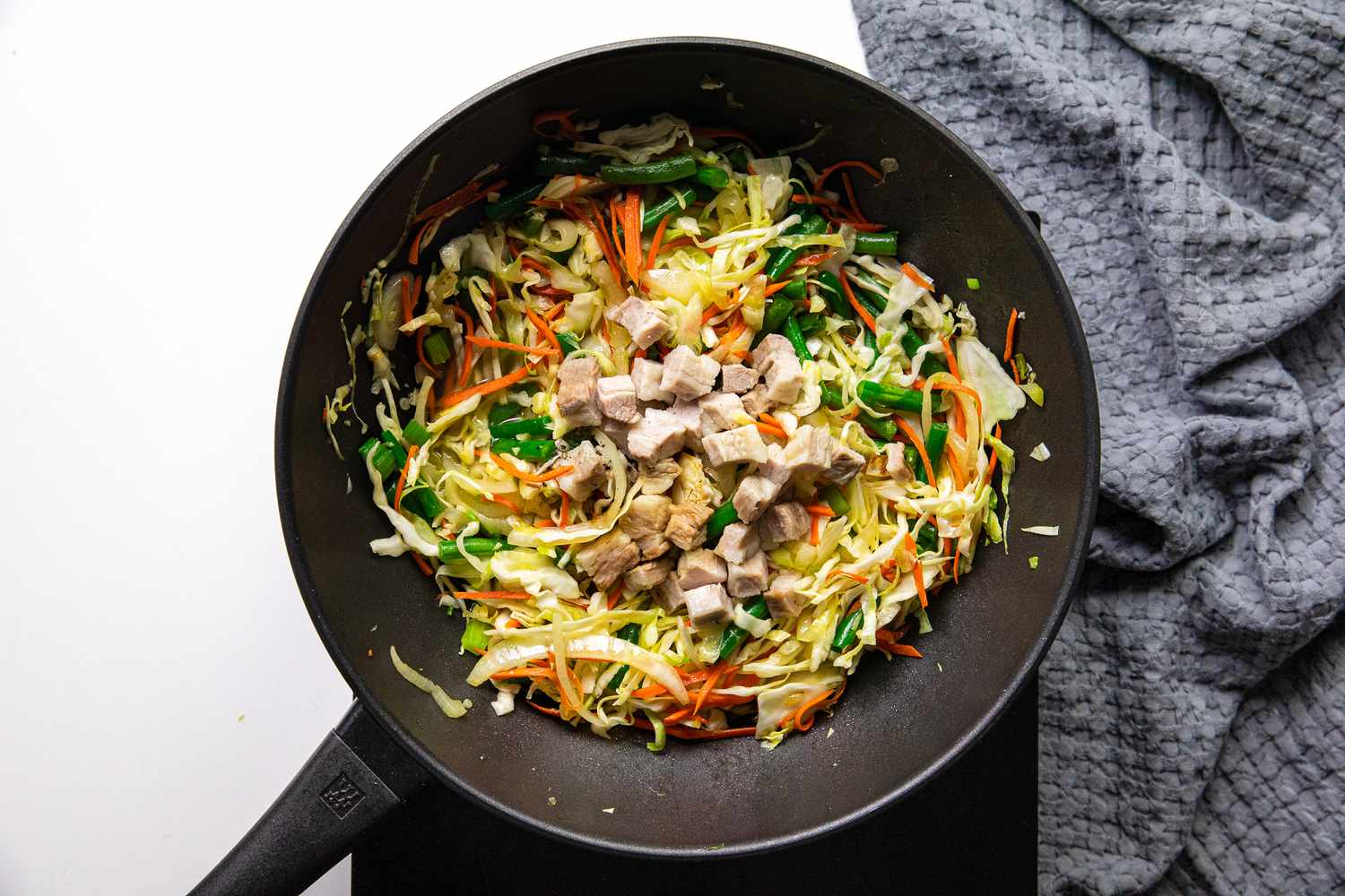 Pork Cubes Added after Vegetables Wilted for Pancit Bihon 