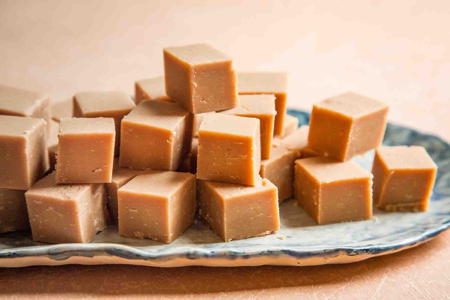 Best Peanut Butter Fudge stacked on a serving tray