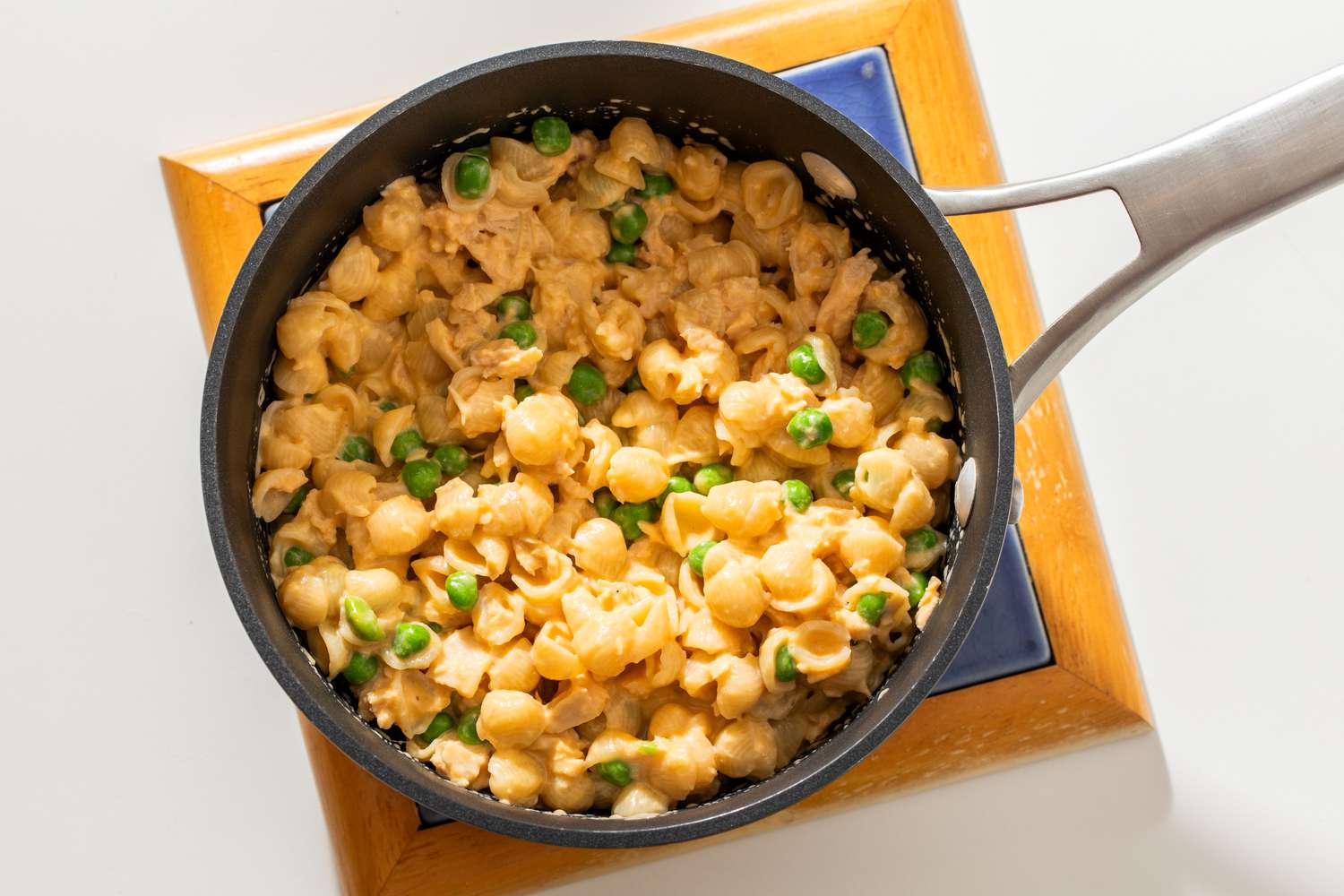stovetop tuna noodle casserole in a pot on a coaster