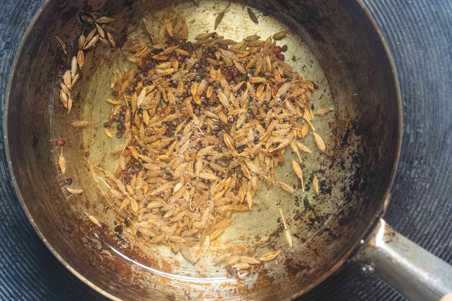 Spices in oil blooming in a skillet