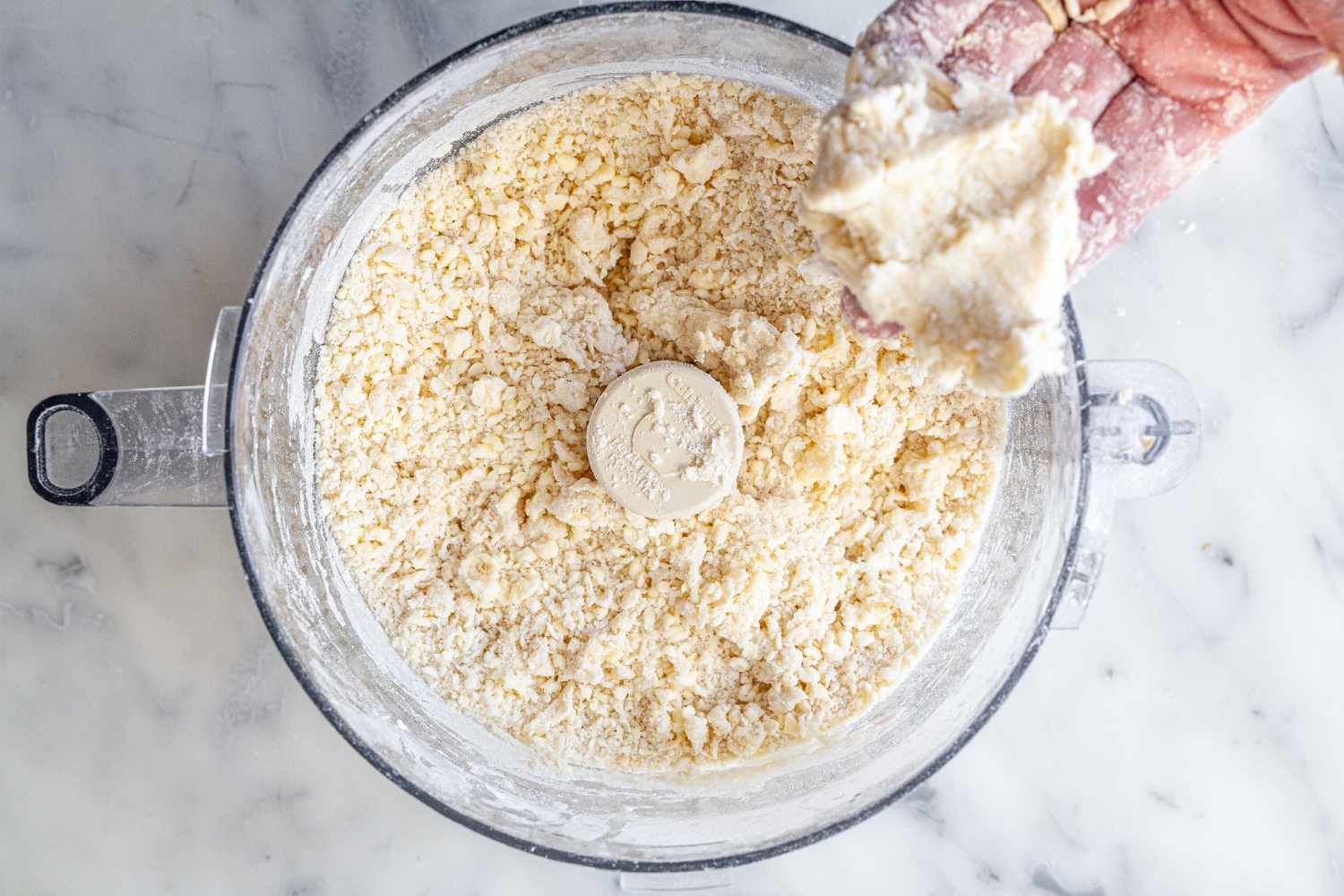 Homemade pie crust made in a food processor.