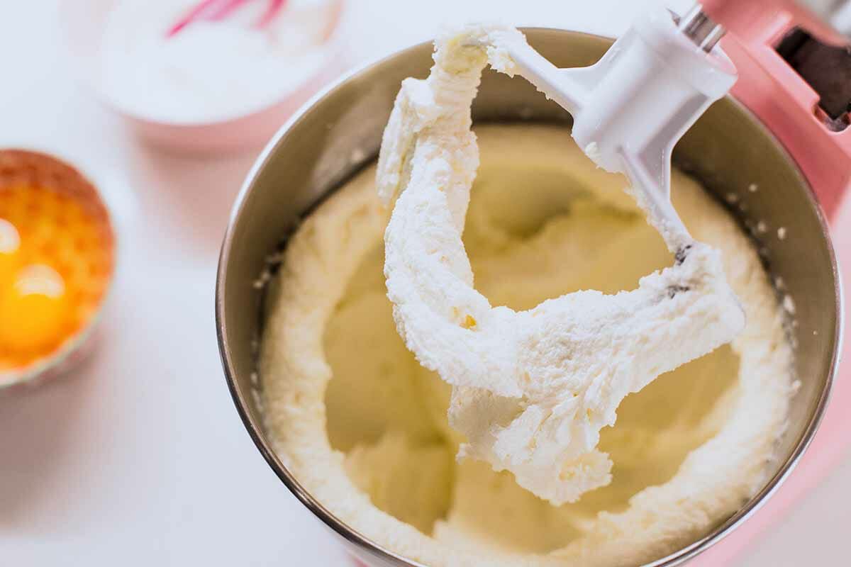 Sugar cookie dough mixed in a stand mixer.