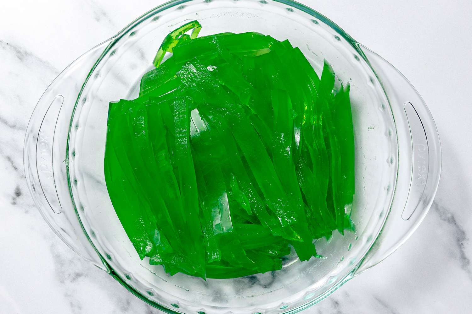 Pandan Jelly in Strips in a Glass Pie Dish