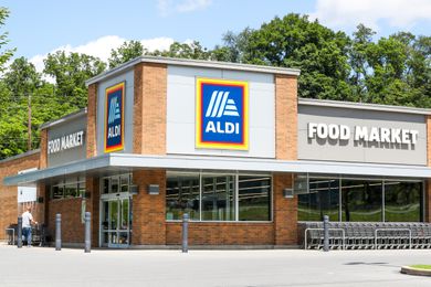 Exterior view of an Aldi food market with logo displayed