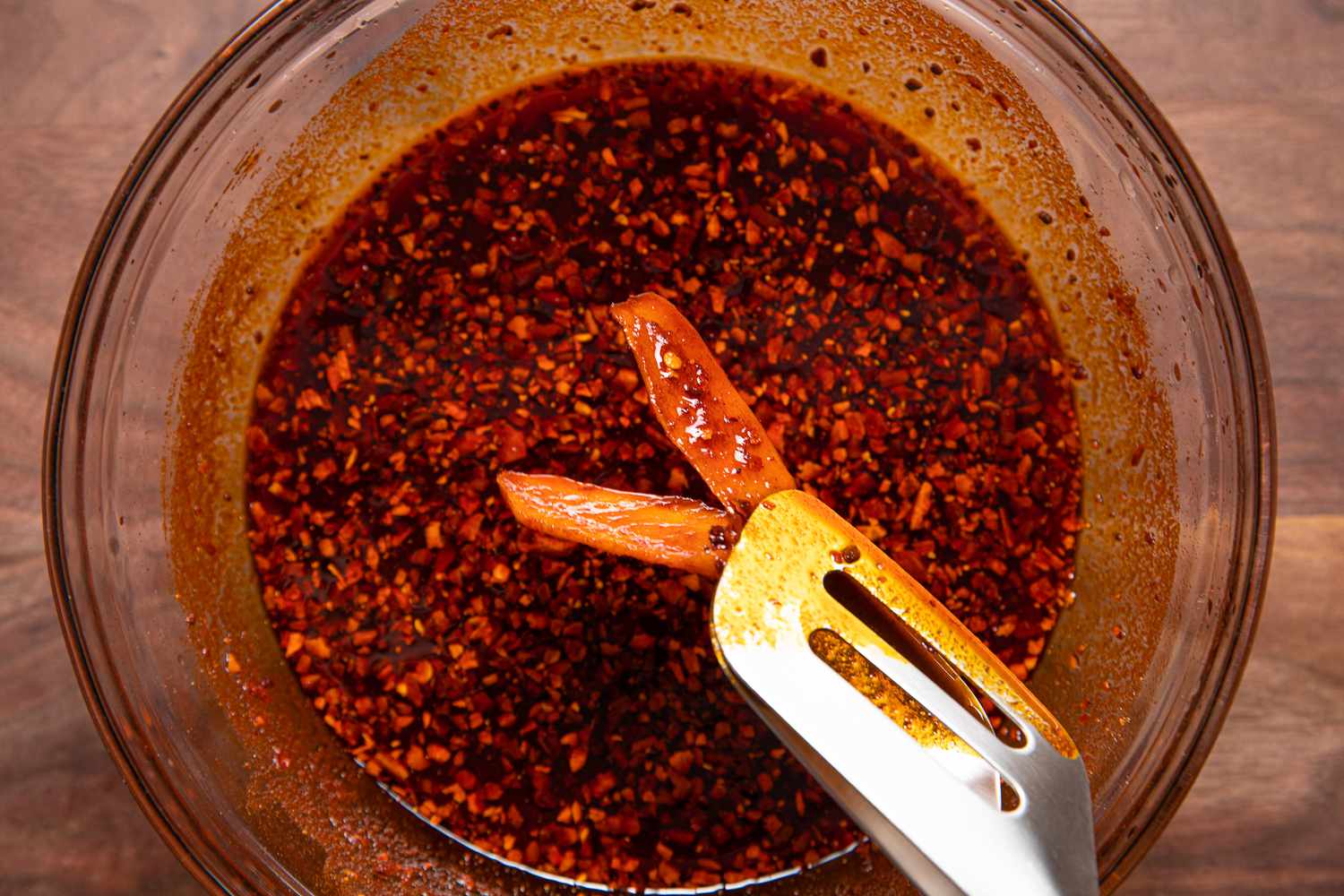 Tongs Used to Remove Ginger from Bowl