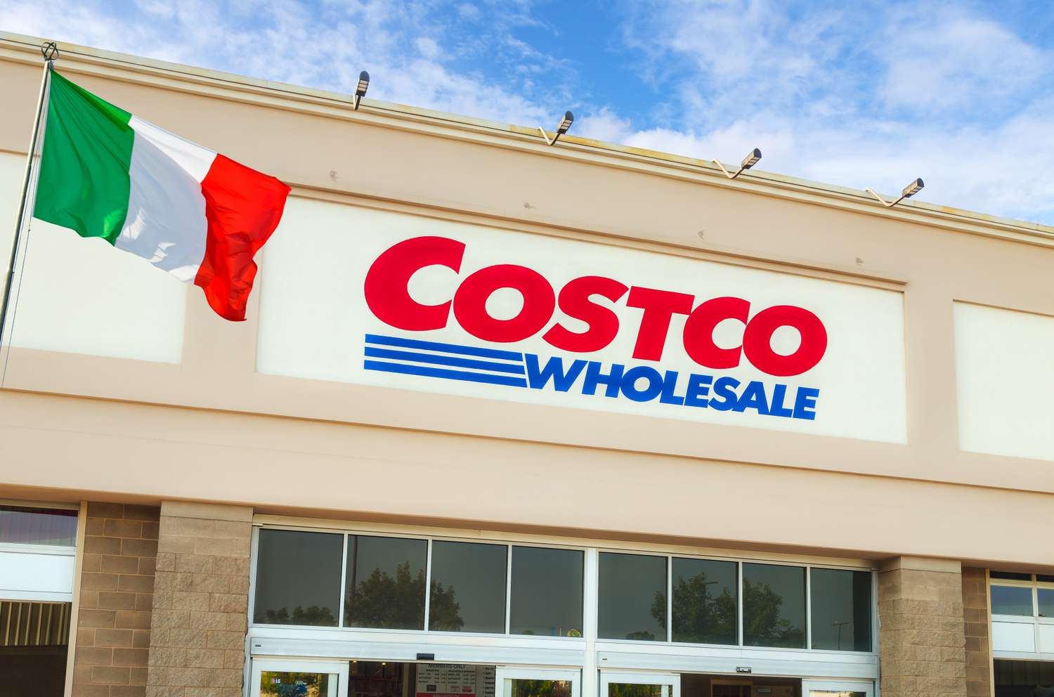 The Costco Wholesale logo with an Italian flag displayed nearby
