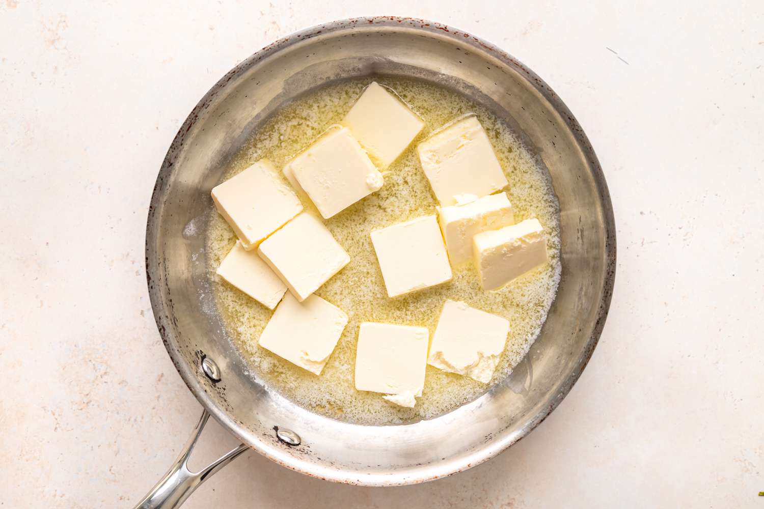 Melting butter in a pot to show how to brown butter.