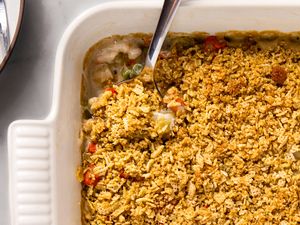 close-up view of Grandma's Creamy Vegetable Casserole with Crunchy Chex Topping in a baking dish