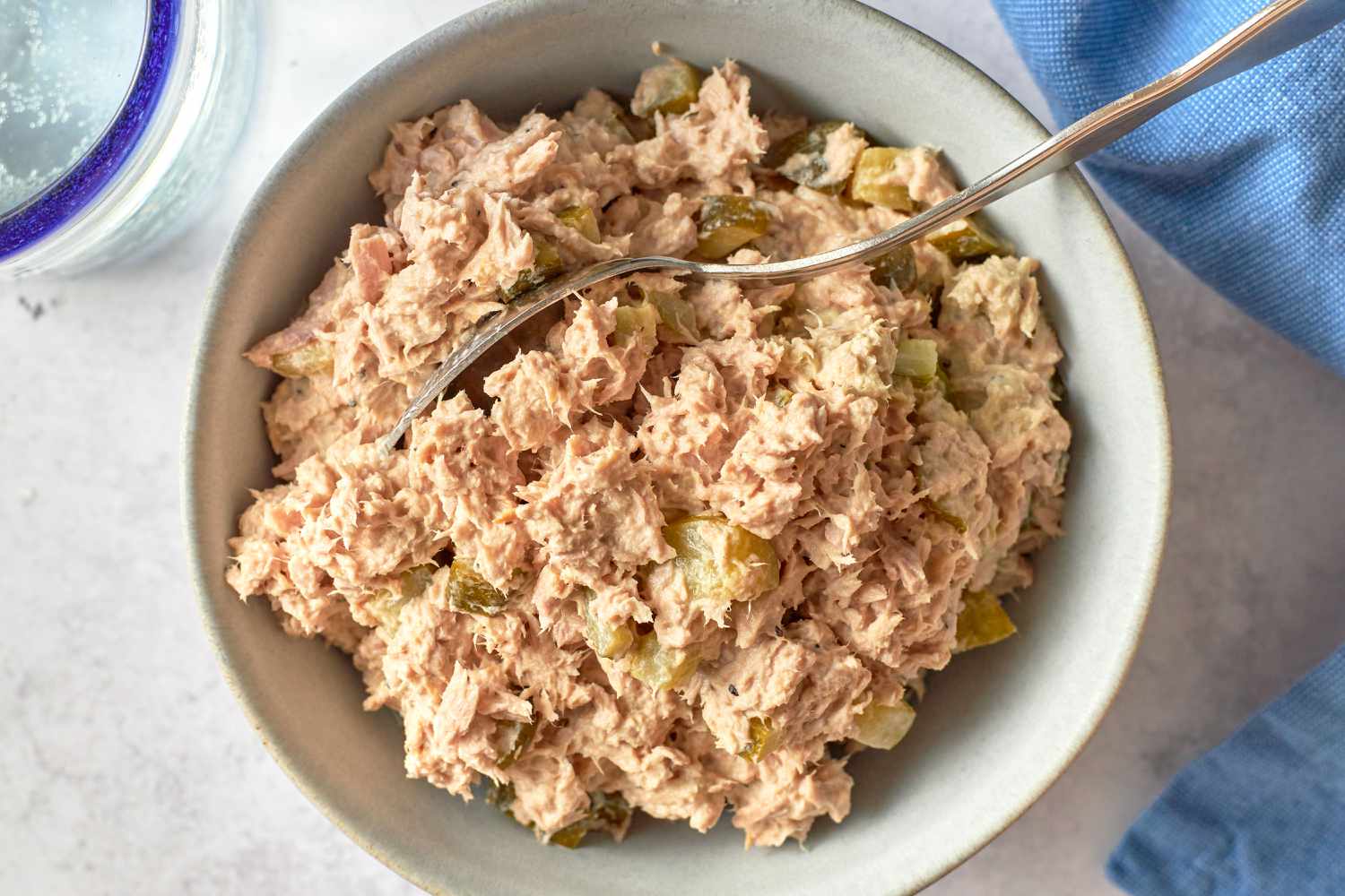 Dill Pickle Tuna Salad in a bowl with a spoon