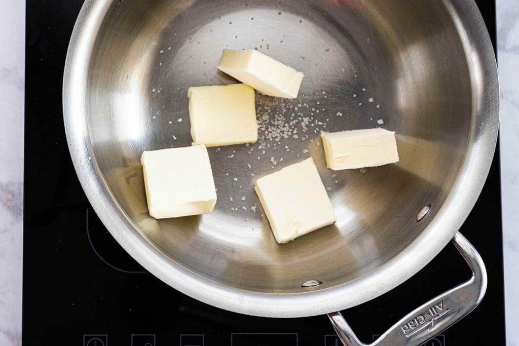 Baked Banoffee Cheesecake - butter cubes in pan