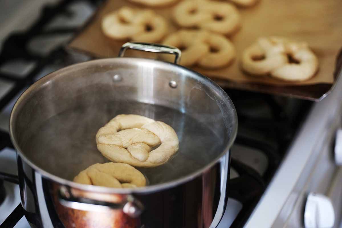 Simmer the shaped soft pretzels in water with baking soda