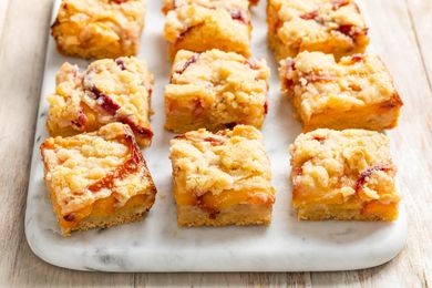 3/4 shot of peach pie bars on marble counter
