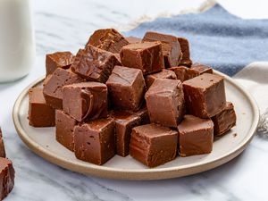 Microwave Fudge cut into squares and piled on a platter