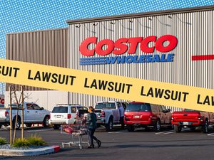 Costco Wholesale store with a lawsuitthemed graphic overlay
