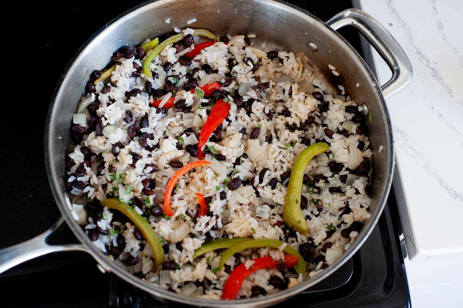 Black beans and rice cooking on the stove.