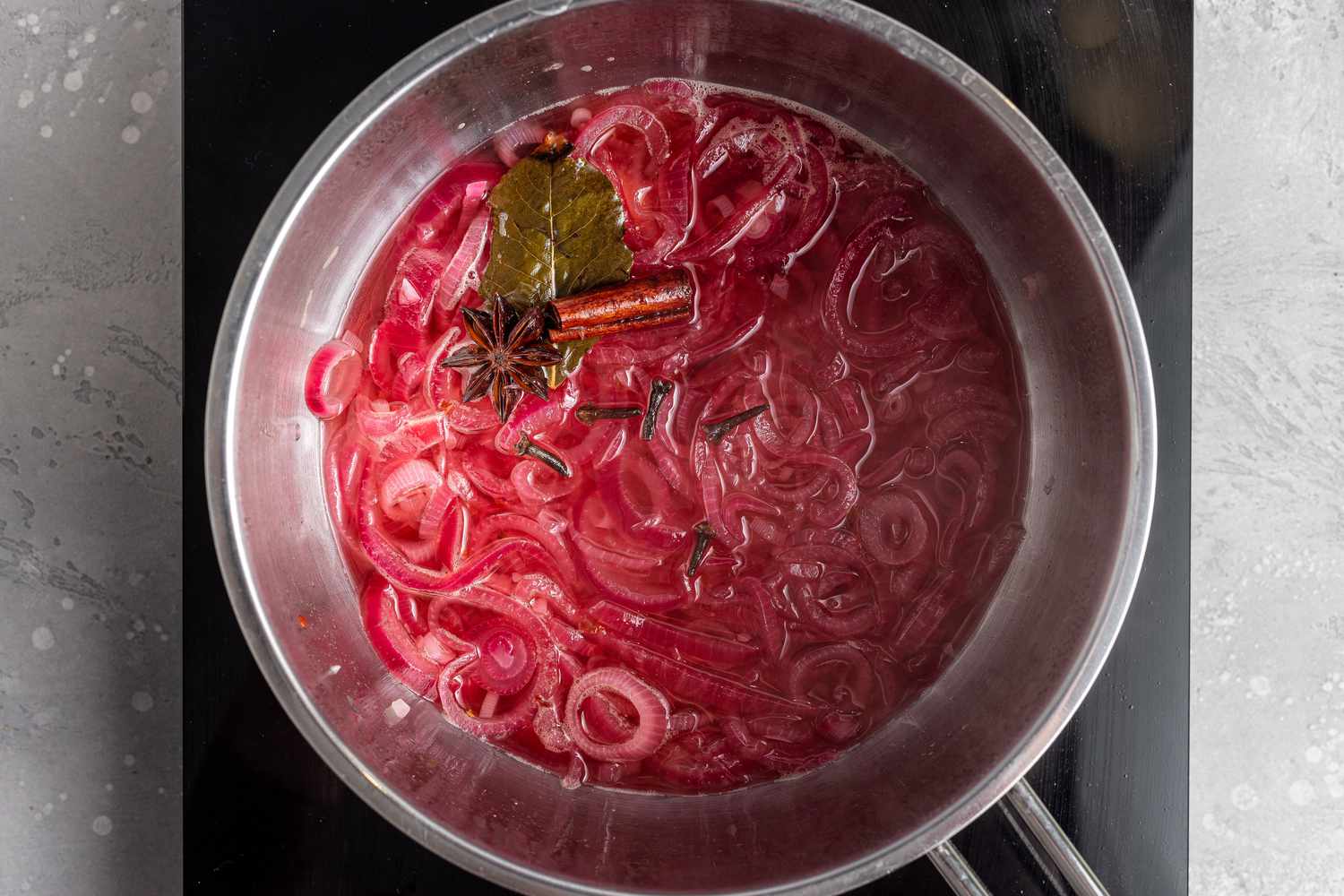 A pot of finished pickled red onions on the stove.