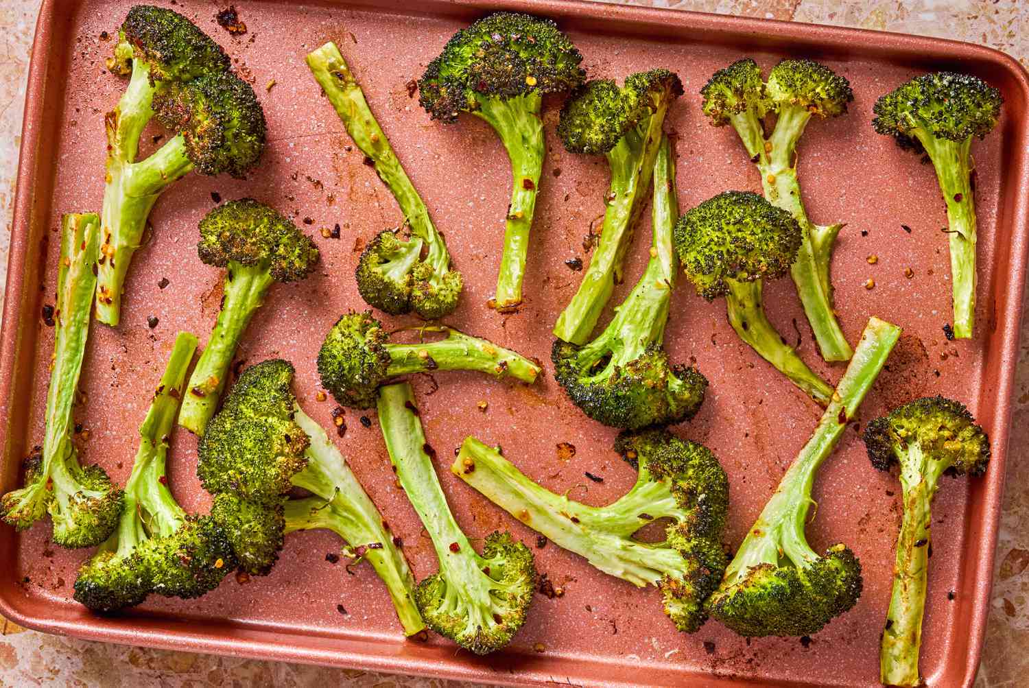 Bang Bang Broccoli on a cooked and on a sheet pan