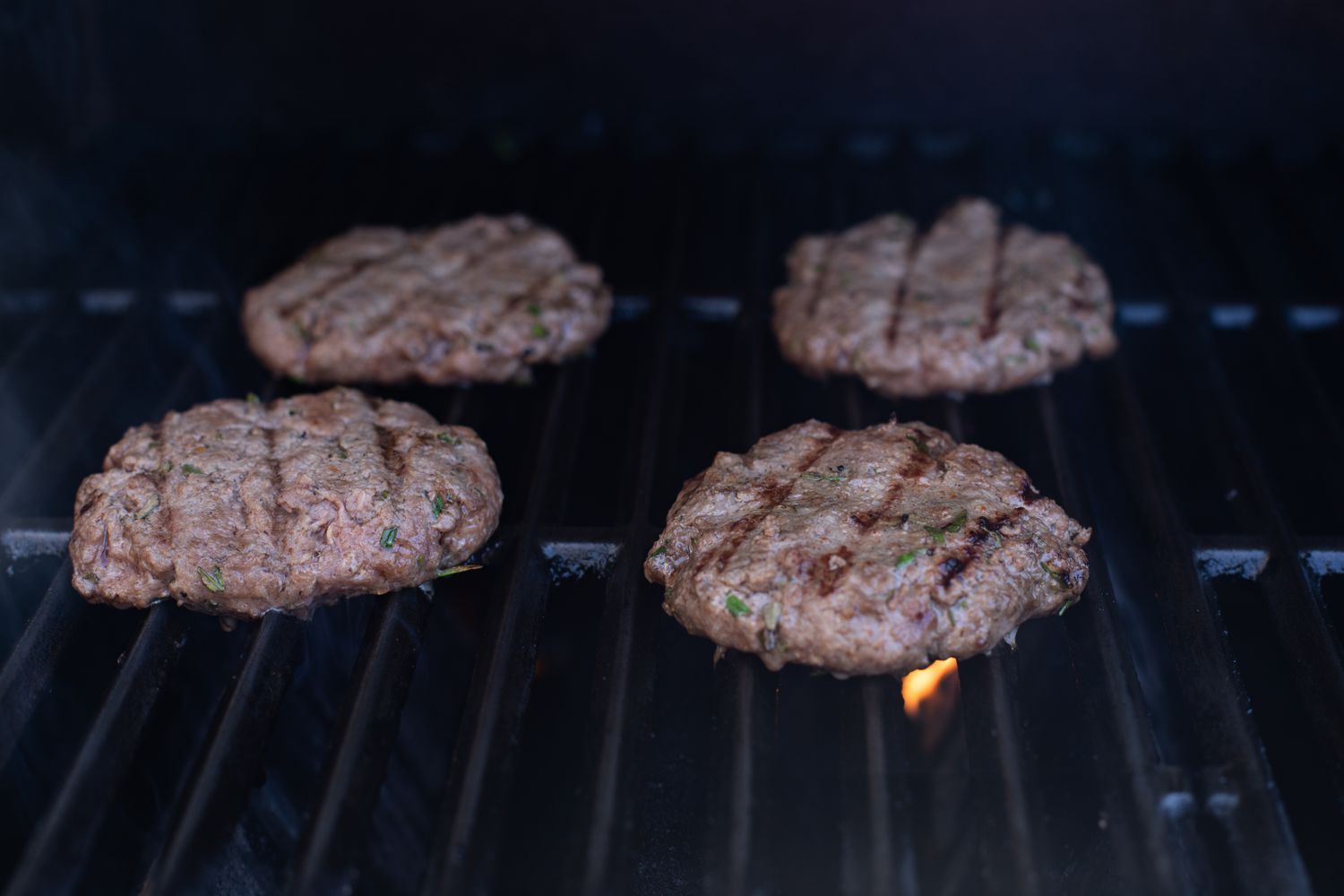 Grilling burgers to make a famous burger.