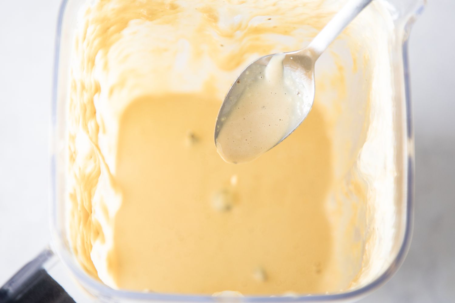 Creamy consistency of vegan caesar dressing
