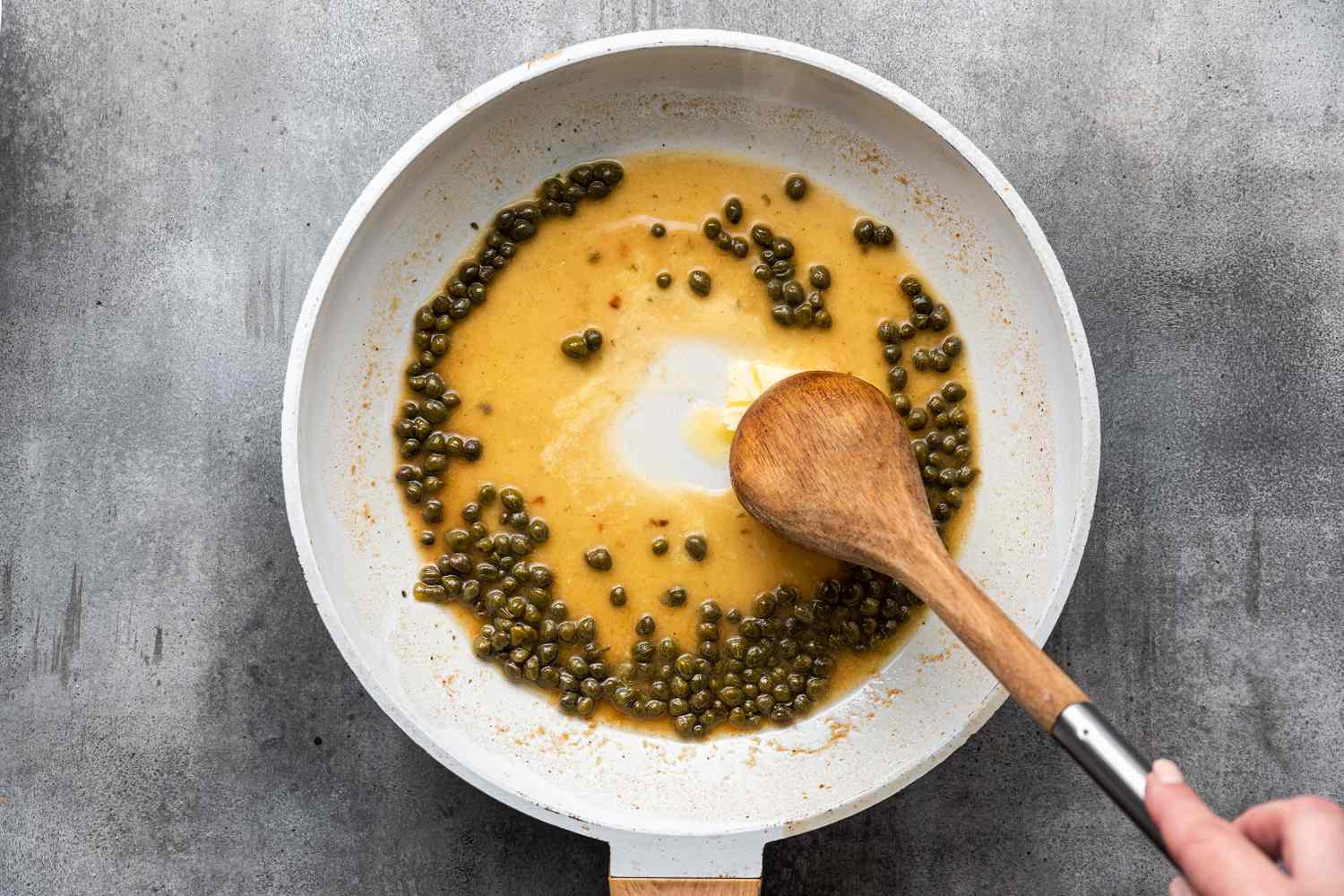 Butter Added to Capers in Wine Sauce for Sole Filet Recipe