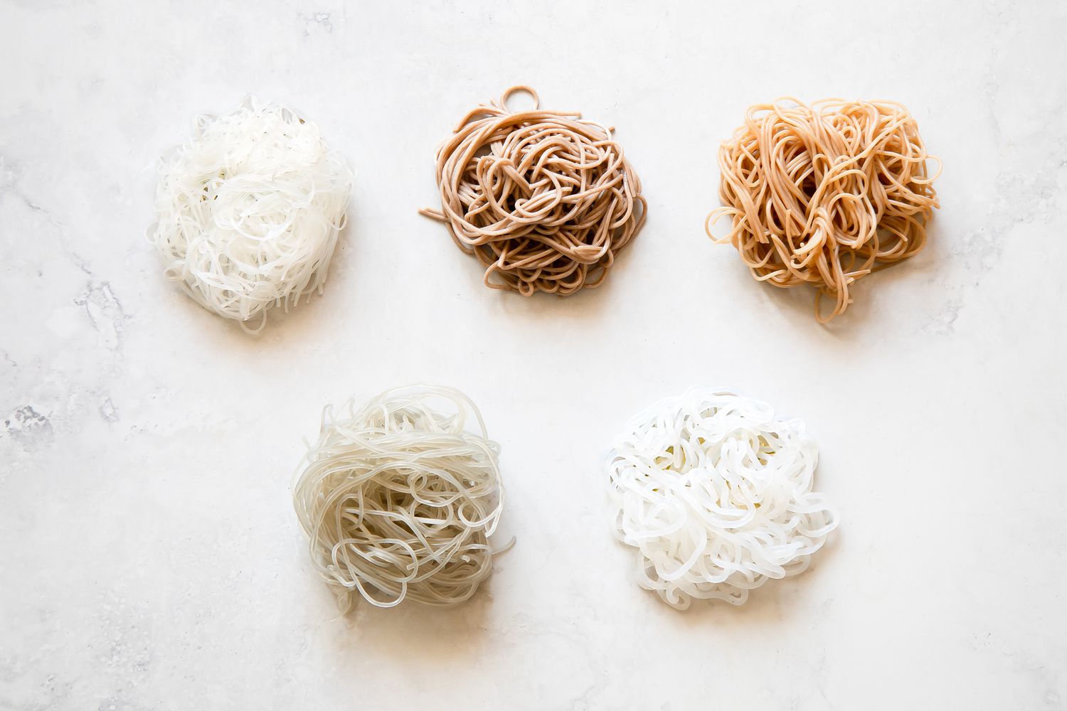 Different Types of Starch Noodles Wrapped Into Little Bundles on the Counter