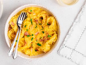 Spaghetti Squash Carbonara in a Bowl with Utensils