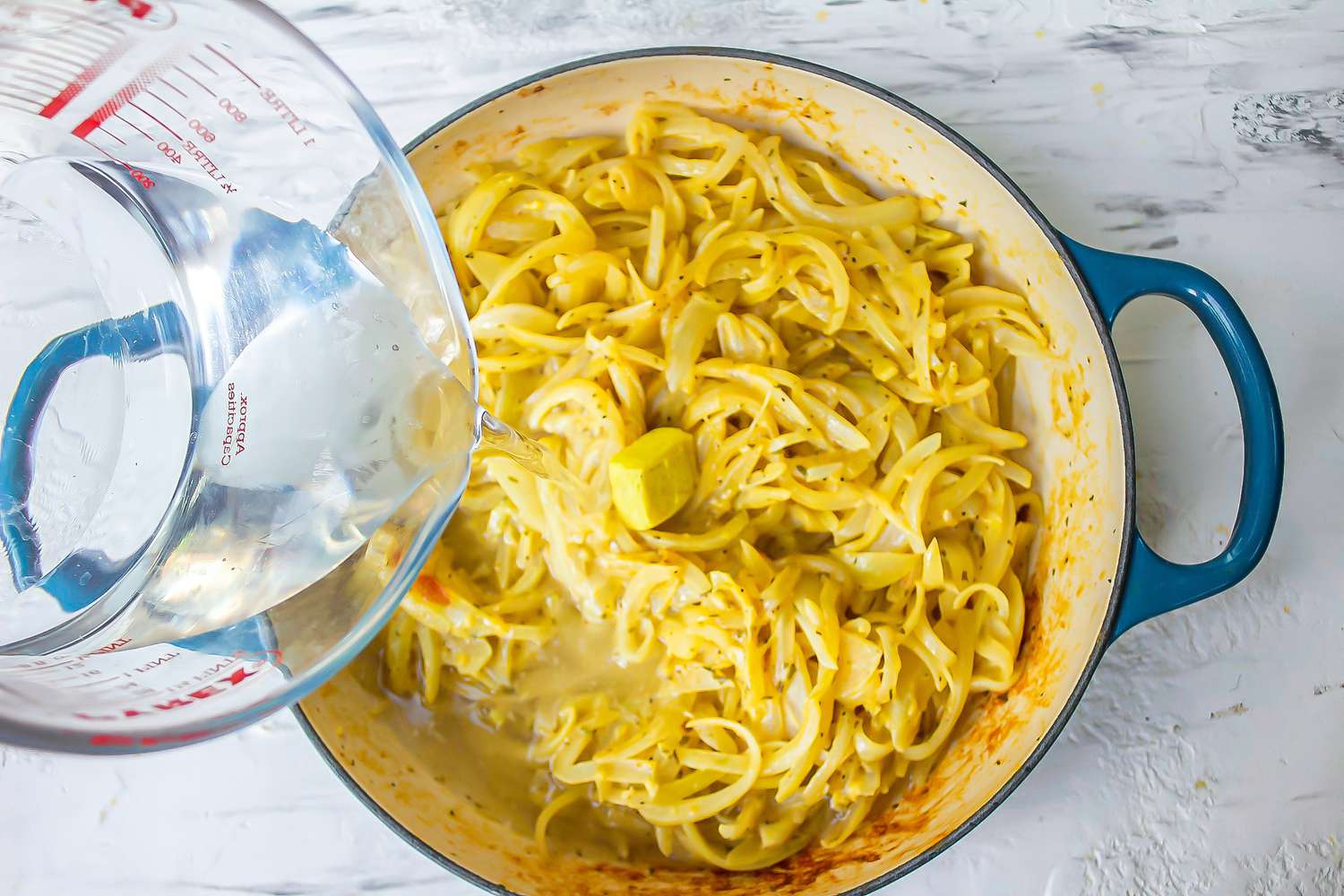 Cooking onions for chicken yassa recipe