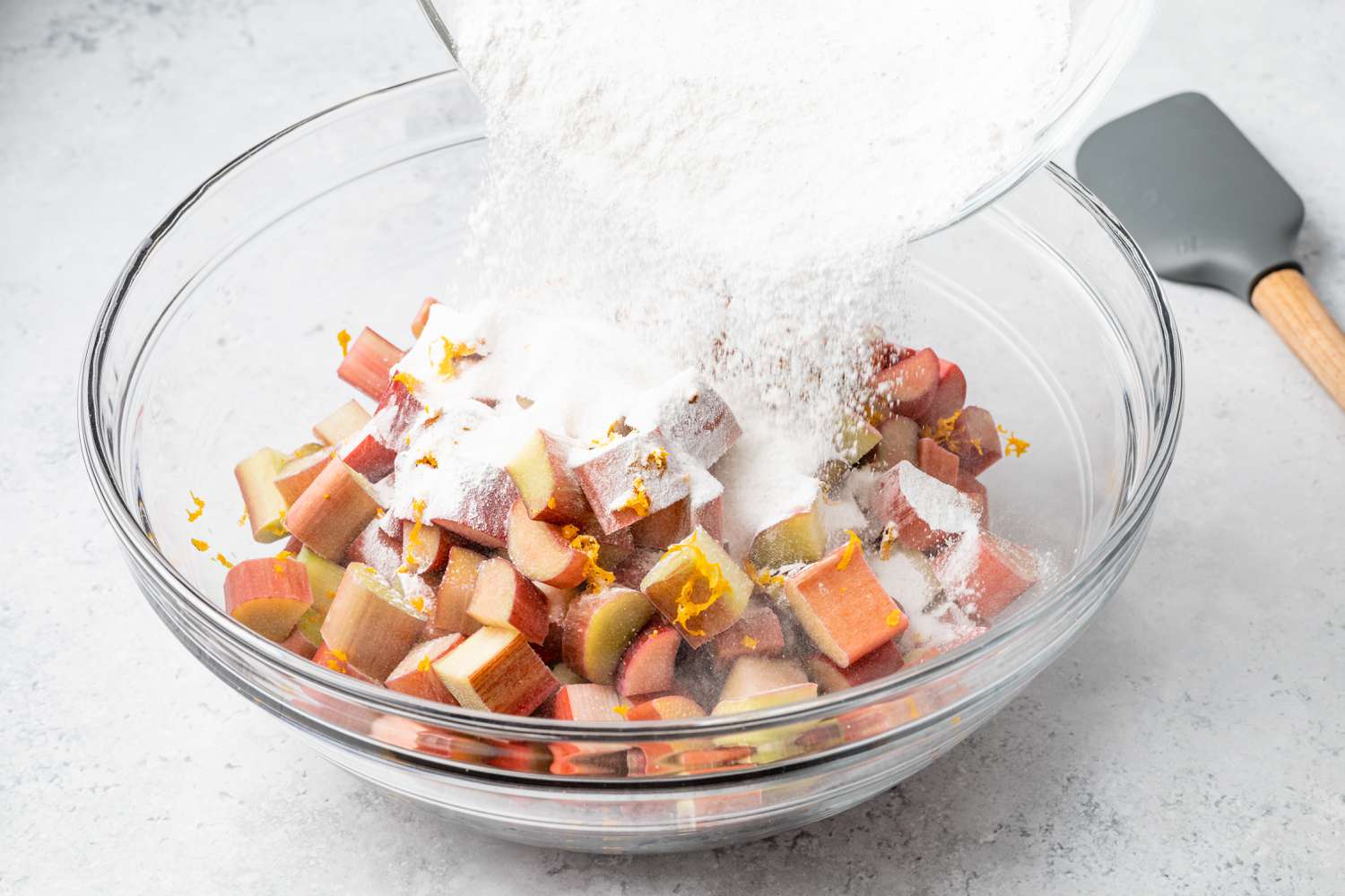 Dry Ingredients Added to Rhubarb and Orange Zest Filling for Pie Recipe