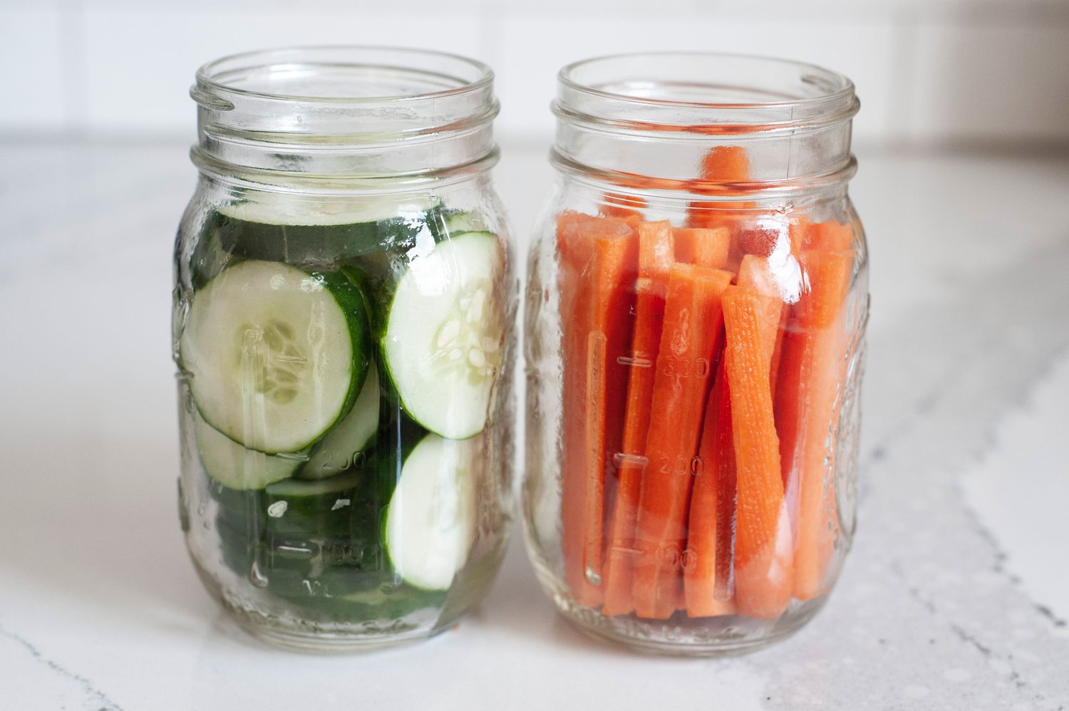 Jars of Cucumber Slices and Carrot Slices for Quick Pickles Recipe