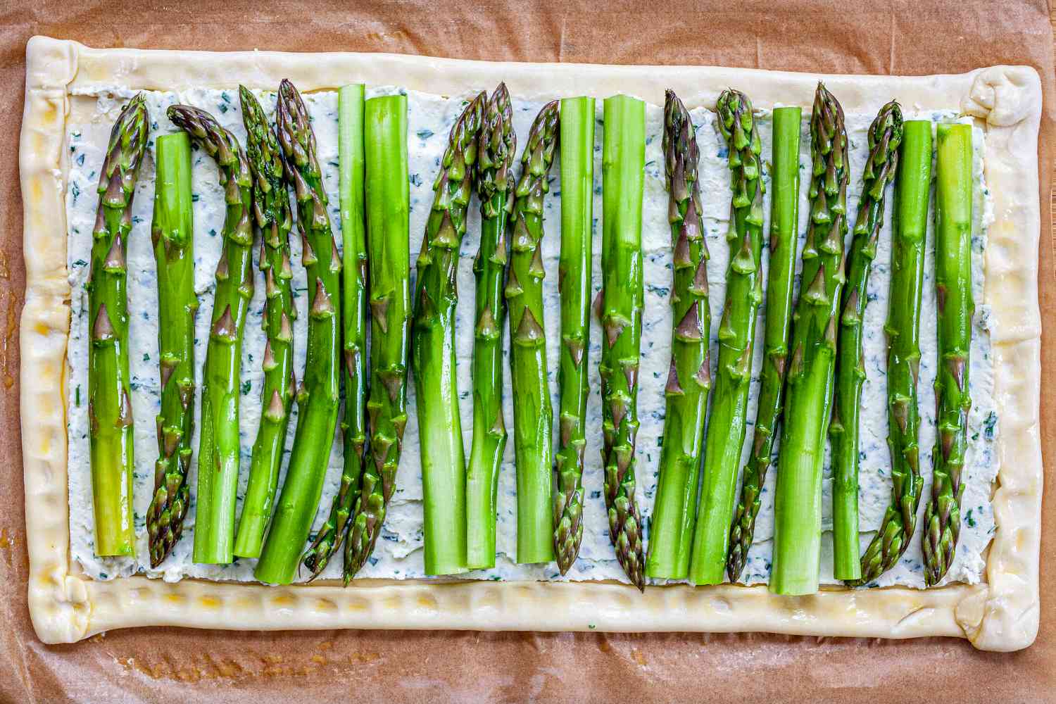 Stalks of asparagus added to an Asparagus Tart with Goat Cheese and Lemon.