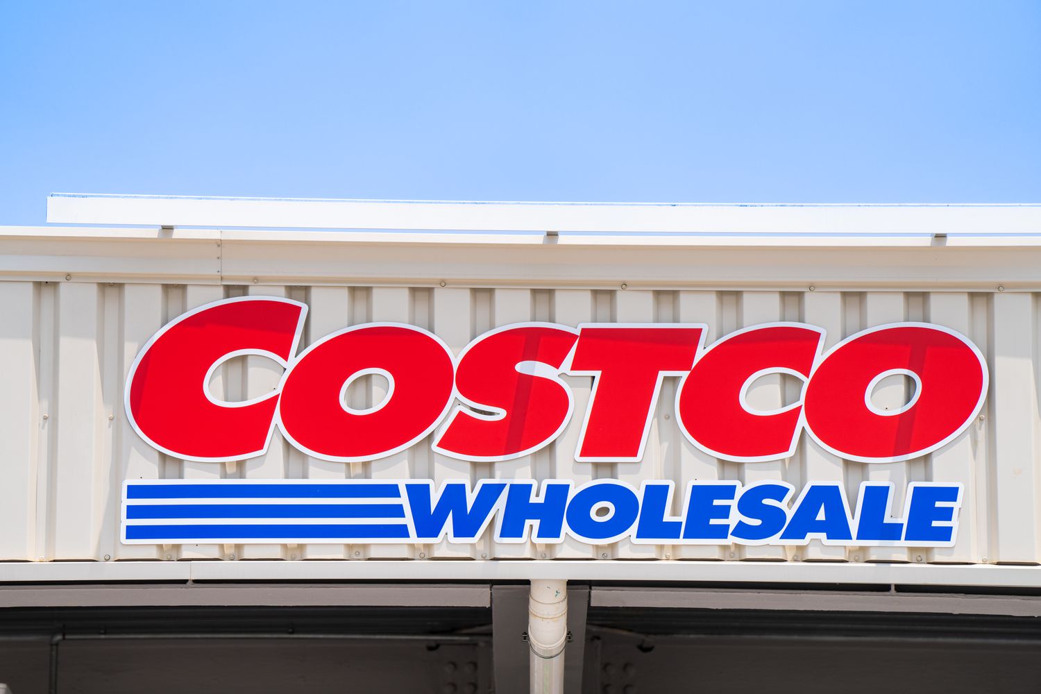 A close-up of a Costco logo on a storefront