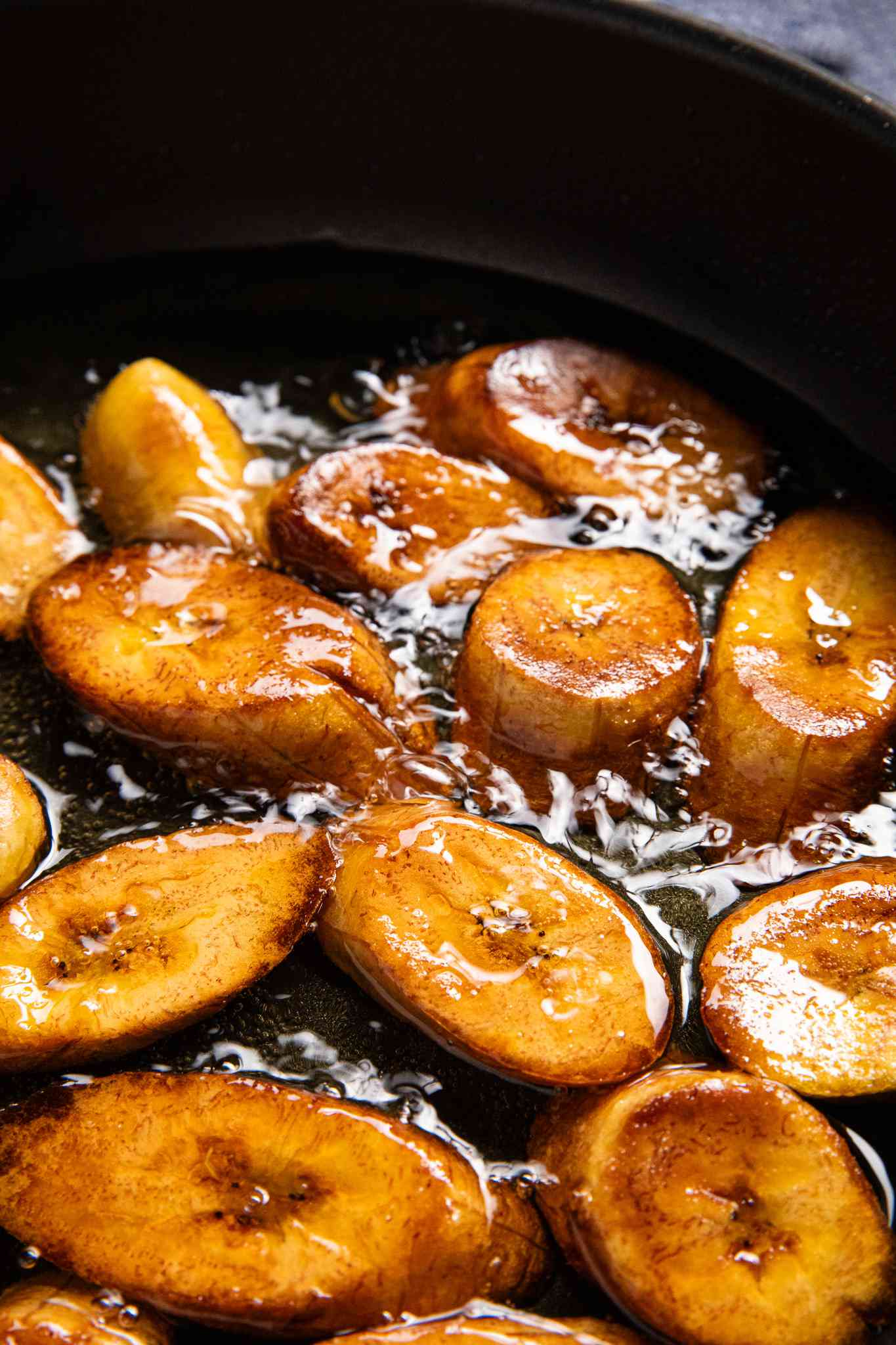 Maduros (Fried Sweet Plantains) Frying in a Pot of Oil Until a Deep Golden Color