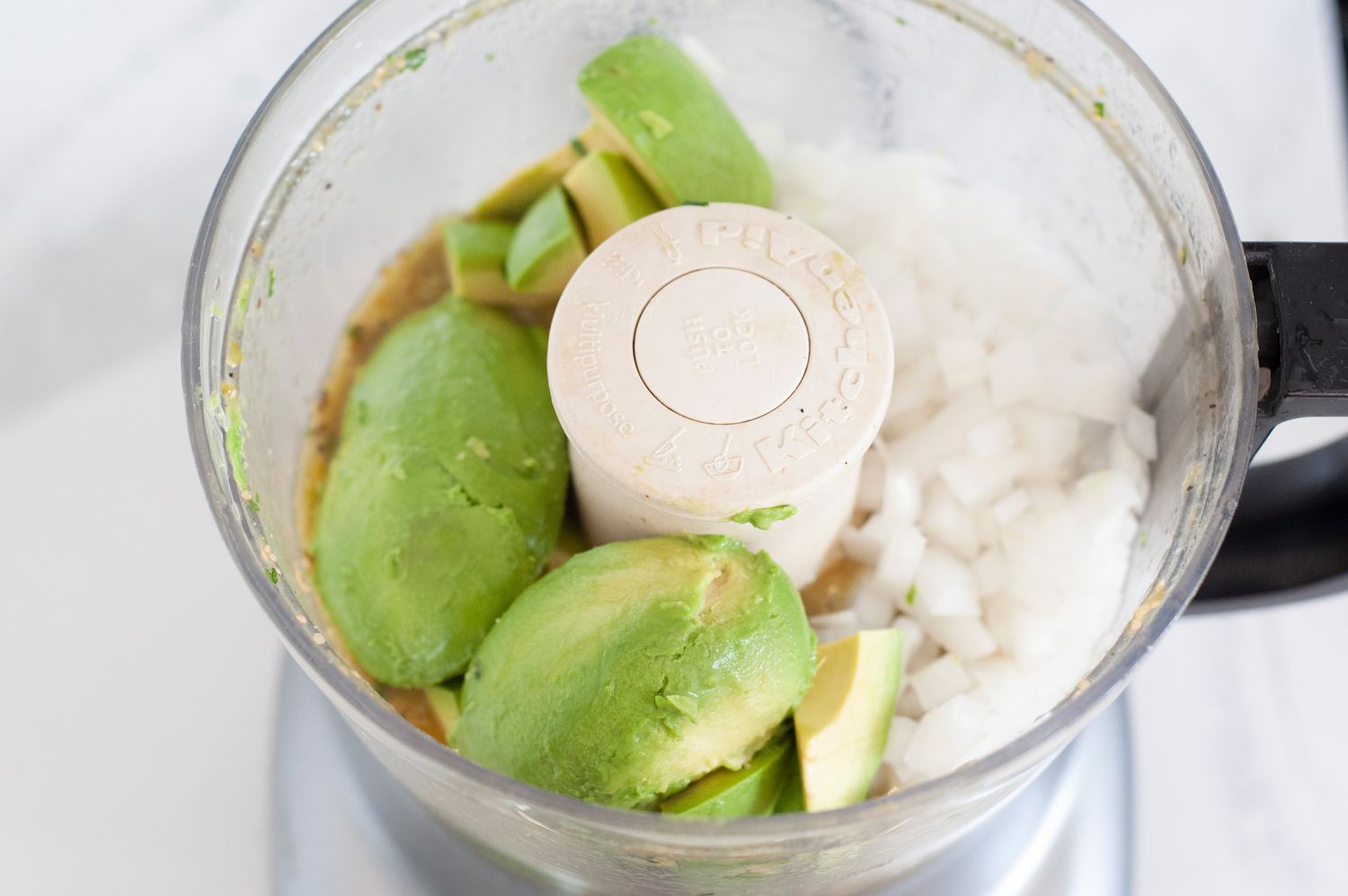 Avocado and Onions Added to Food Processor with Tomatillo Avocado Salsa