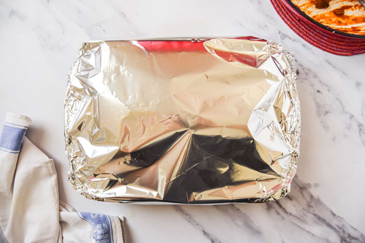 Vegetarian Spinach and Mushroom Lasagna Covered with Aluminum Foil