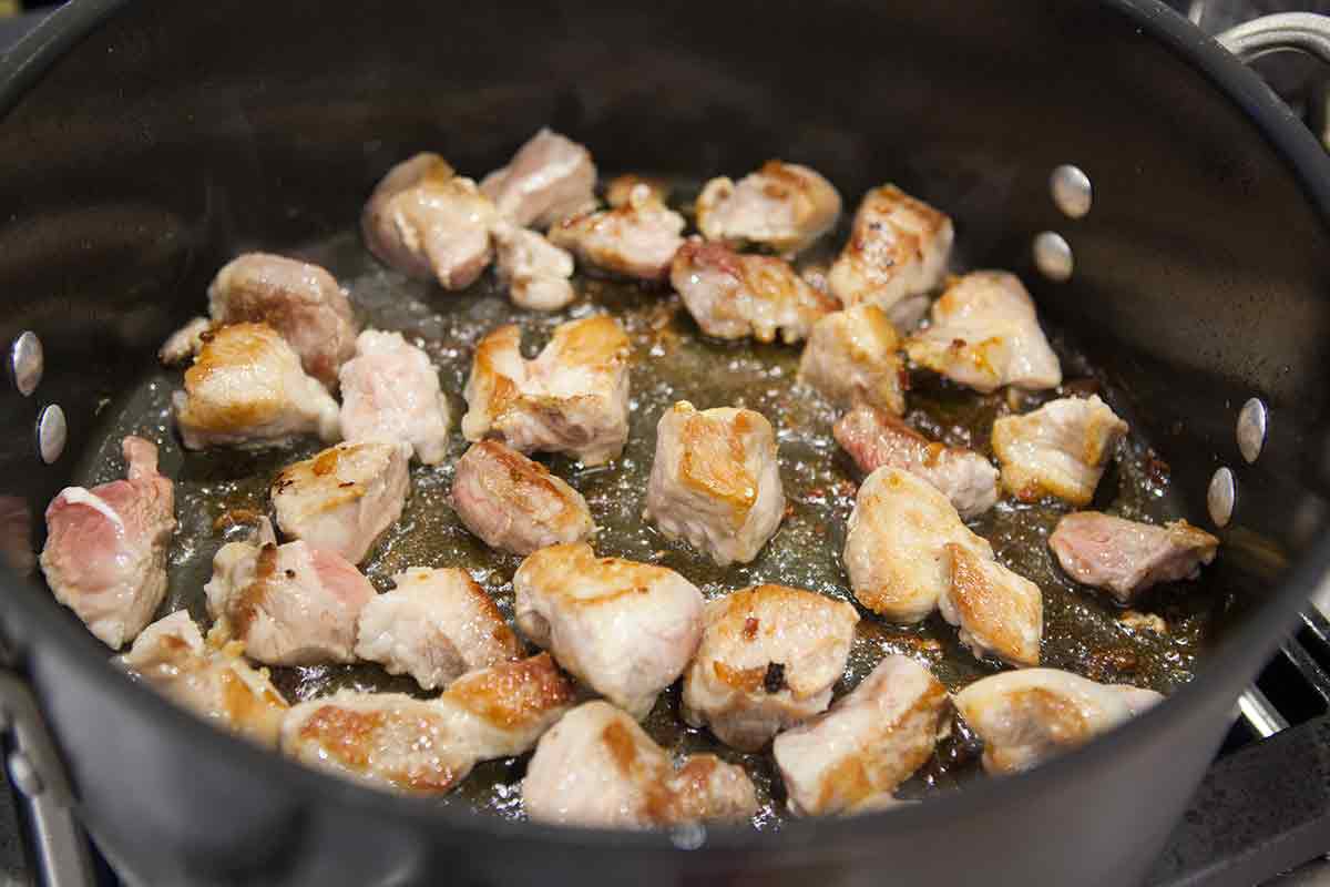 Pork browned on all sides in a pot