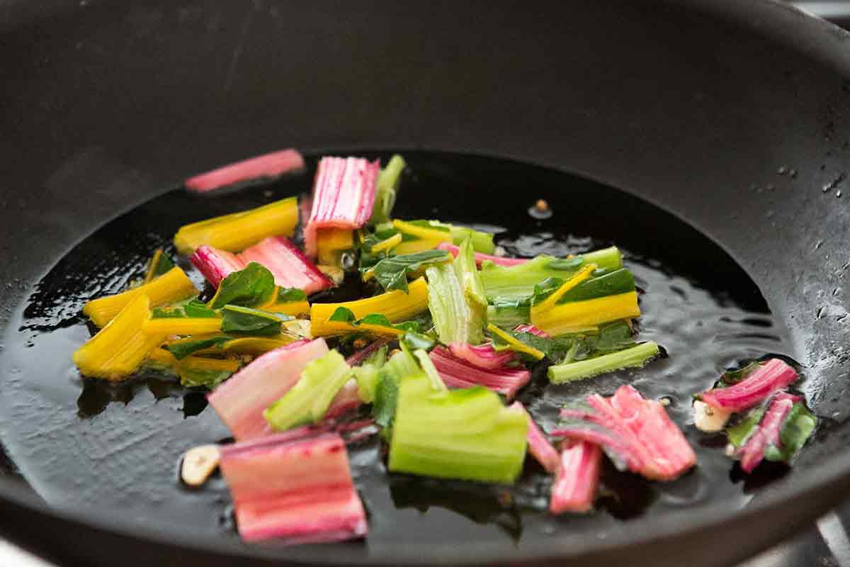 Swiss chard stalks cooking in a pan