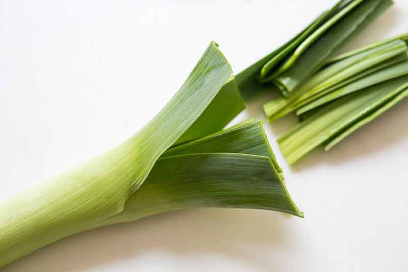 cut off the top green parts of the leeks to prep the leeks