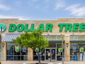 The facade of a Dollar Tree store with its logo prominently displayed on the building
