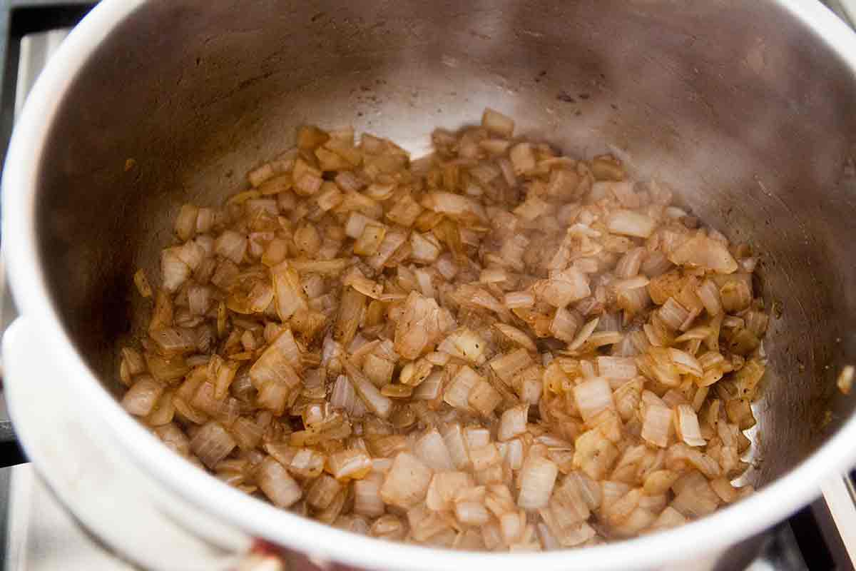 caramelize chopped onions in a pot to make a dip