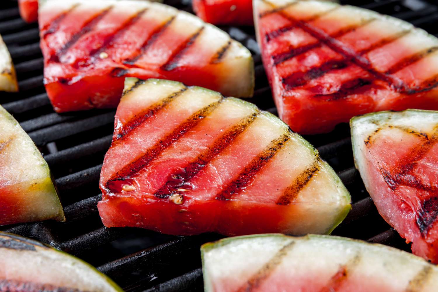 Watermelon wedges with grill marks on the grill