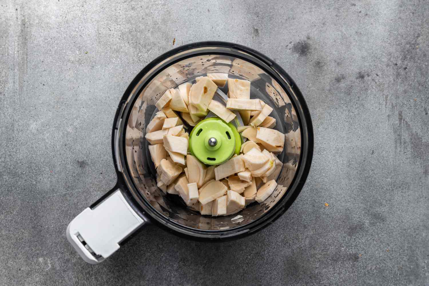 Chopped Horseradish root in a Food Processor